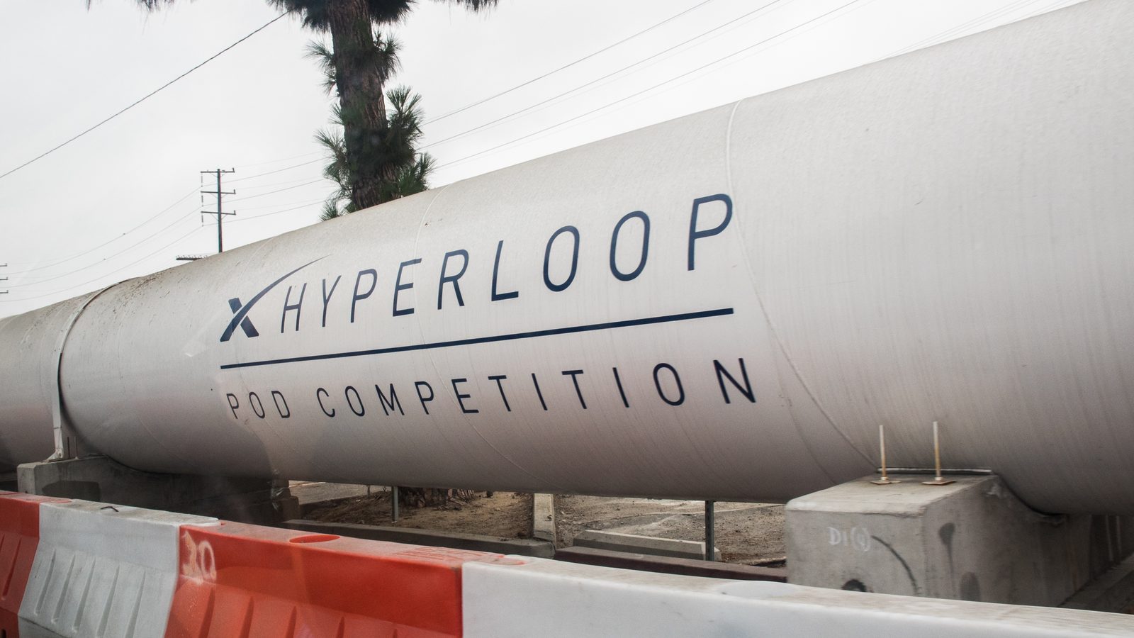 The white SpaceX Hyperloop test tube in Hawthorne, California, lettered Hyperloop Pod Competition, in August 2017