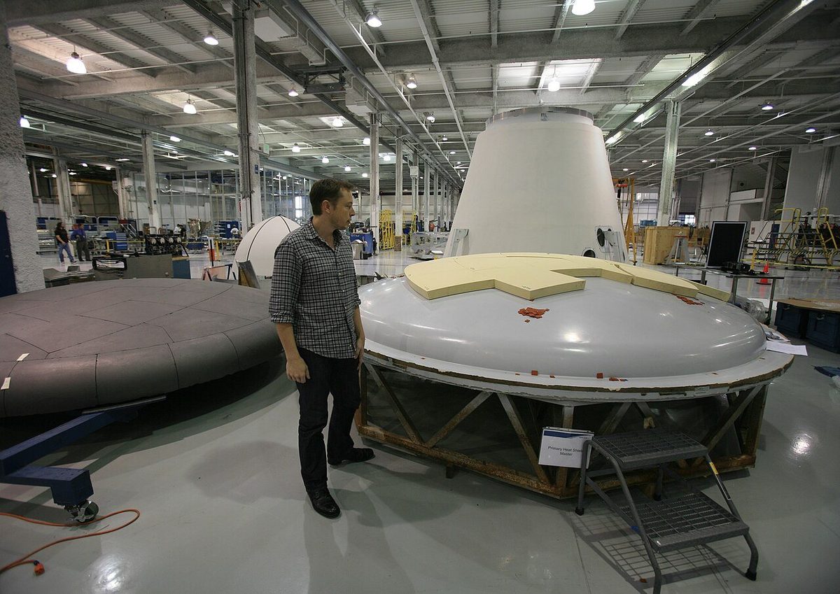 Elon Musk inspecting a heat shield assembly at the SpaceX factory in 2008