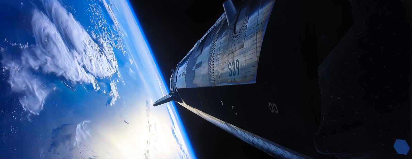 Starship coasting in orbit, Earth filling the view below