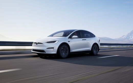 White Tesla Model X on the highway
