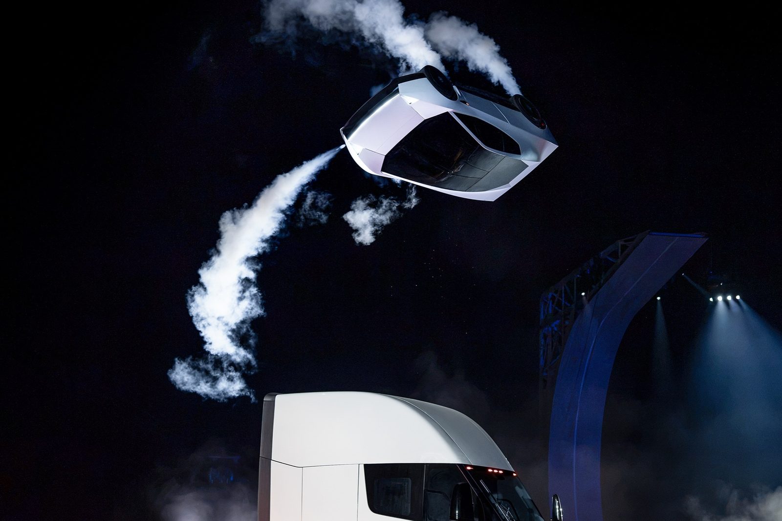 The next-generation Roadster upside down above a Tesla Semi at its reveal
