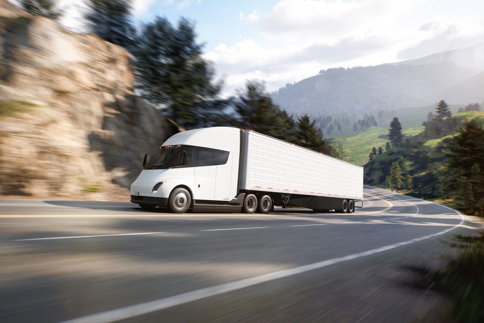 Tesla Semi hauling a trailer on a mountain highway