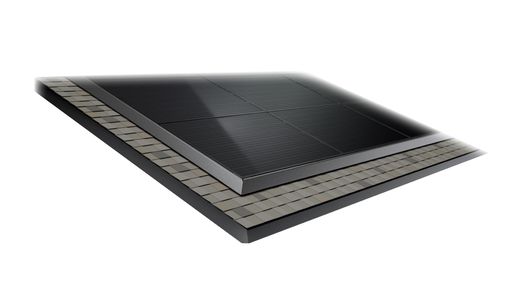 Tesla Solar Roof tiles with a glass solar section bordered by textured shingles
